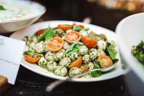 Mocarella Balls With Tomatoes Slices On Brunch