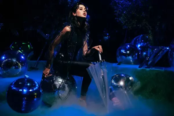 Model posing in the fairy-tale setting with disco balls and fog at Berlin Photo Week.jpg