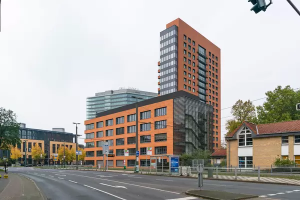 Moder orange office building near harbor in Düsseldorf, Germany