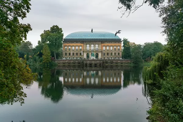 Modern art museum (Kunstsammlung) in Düsseldorf with seagull flying in front of it