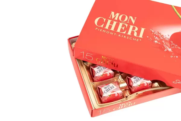 Mon Cheri Chocolate with copy space above white background