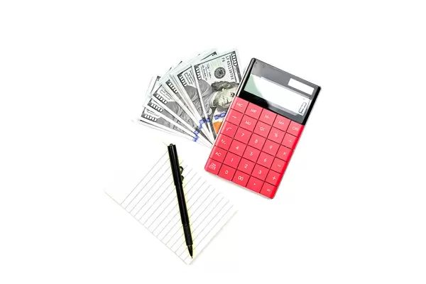 Money, calculator, notepad and pen on white background