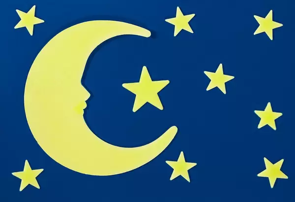 Month and stars in the night sky