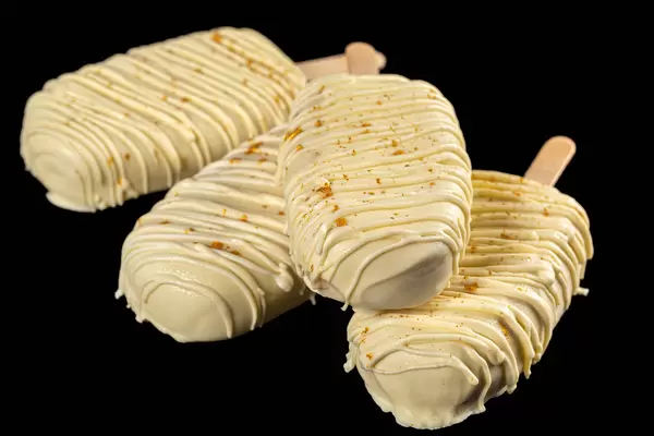 Mousse cakes covered with white chocolate glaze