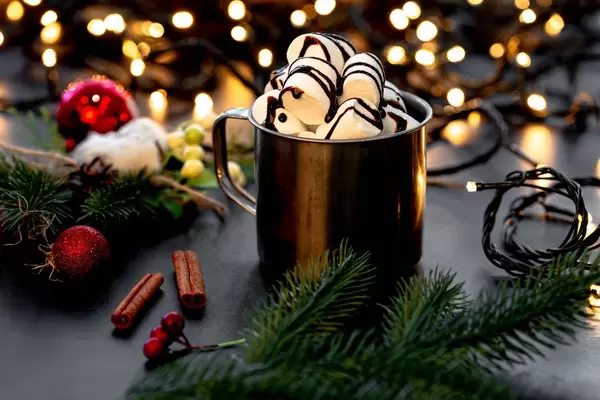 Mug with hot chocolate and marshmallows on a Christmas background with bokeh (Flip 2019)
