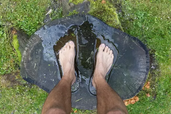 Mühlbach hike: standing barefoot in the pre-prepared footprints of the "Platform for your senses"