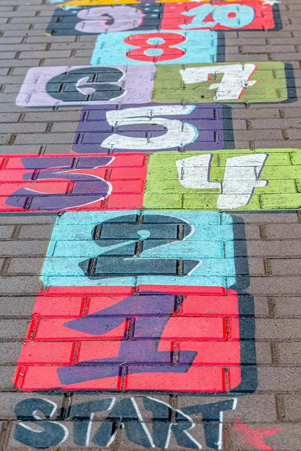 Multi-colored drawing on the pavement with numbers. Children's classic game