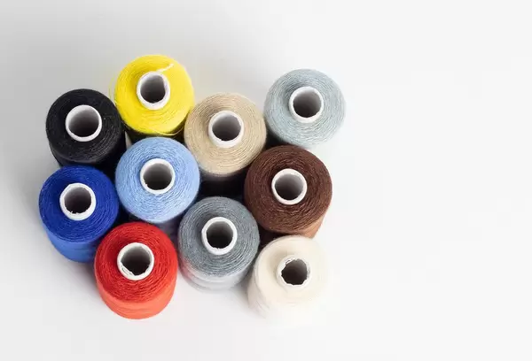 Multi-coloured cotton reels seen from above