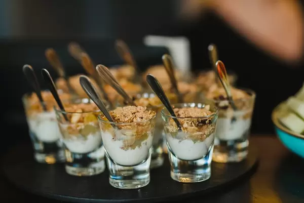 Musli And Cream Dessert On Glass Cups
