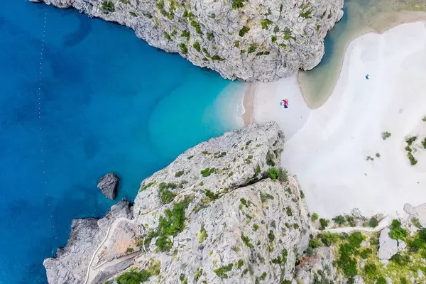 Must-see on Majorca: the remote, hidden beach of Sa Calobra with its canyon. Overhead shot
