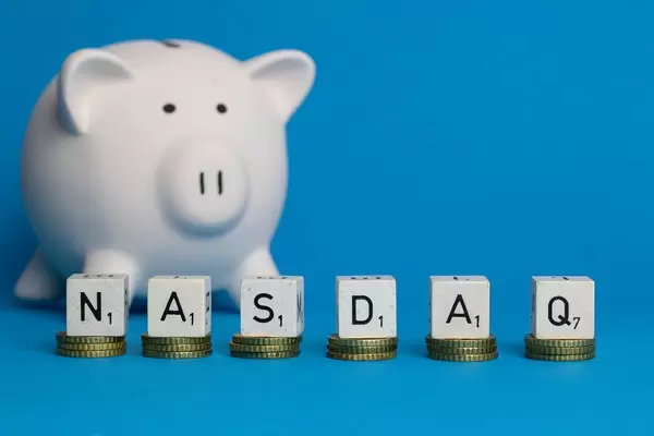 Nasdaq text with piggy bank
