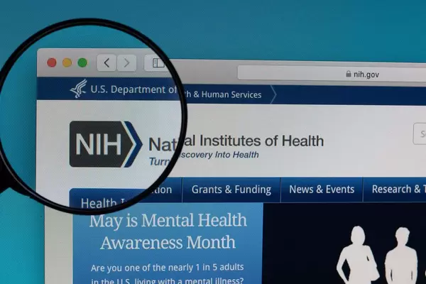 National Institutes of Health logo under magnifying glass