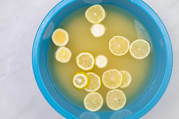 Natural Elderberry syrup with sliced lemons