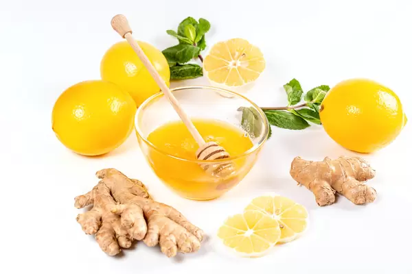 Natural medicine concept. Ginger, honey, lemon and mint