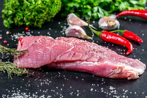 Natural spices and raw meat on black background (Flip 2019)