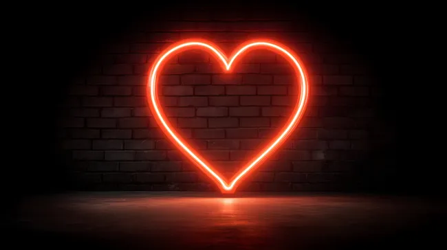 Neon-Herz vor Backsteinhintergrund