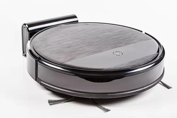 New black robot vacuum cleaner on white background