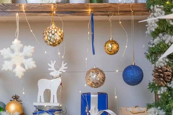 New Year decoration and gift on shelves with garlands