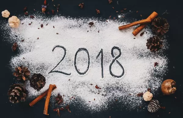 New Year flatlay. 2018 written with flour an and other seasonal ingredients