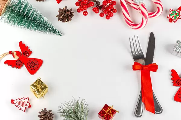 New year frame with knife, fork and christmas decor with free space