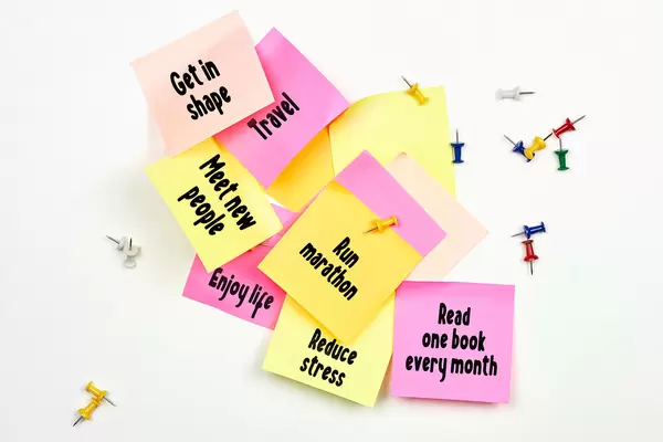 New year goals - colorful sticky notes on a whiteboard