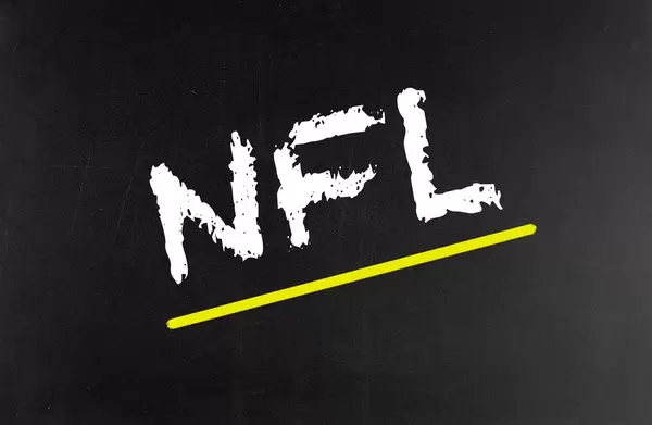 NFL text written on blackboard
