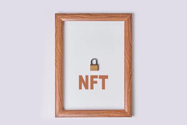 NFT digital crypto art in wooden frame. Non-fungible token cryptocurrency