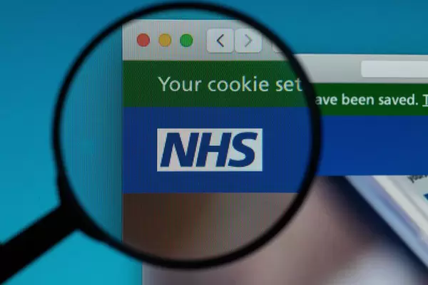 NHS logo under magnifying glass