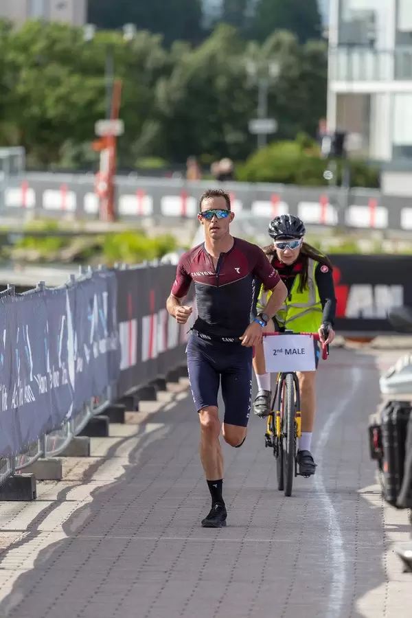 Nicholas Kastelein runs the marathon during the Ironman 70.3 - Triathlon in Lahti, Finland, with bicycle escort