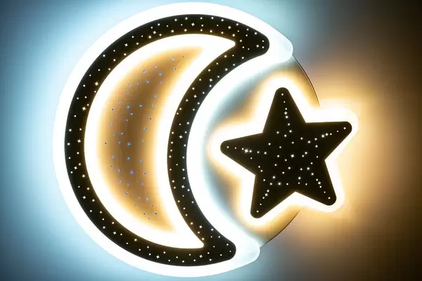 Night light moon and star in the children's room at night