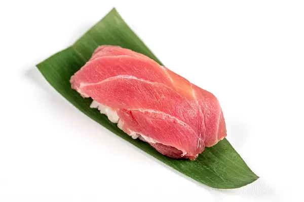 Nigiri with tuna fillet on a green leaf