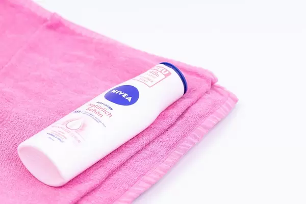 Nivea cosmetics on the towel with copy space