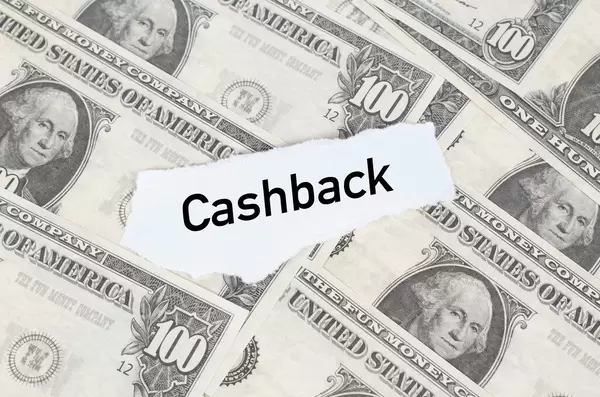 Note with Cashback text on dollar banknotes