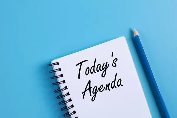Notebook with 2021 Today's Agenda text on blue background