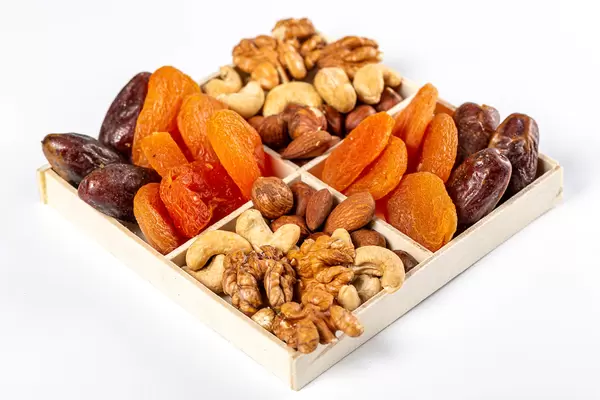 Nuts and dried fruits in a box, healthy snack concept