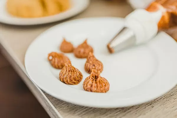 Nuts Cream Filling On White Plate (Flip 2019)