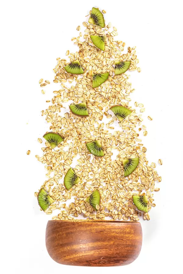 Oat flakes with kiwi slices, top view