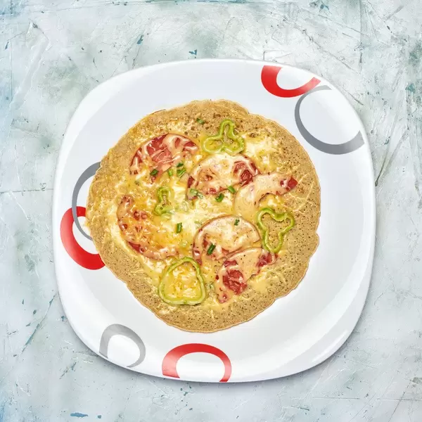 Oat flour pizza with fresh vegetables