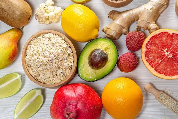 Oatmeal flakes with colorful fruits and ginger root. Concept ingredients for making a healthy Breakfast (Flip 2019)