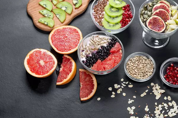 Oatmeal, fresh fruit and seeds. Healthy food, Breakfast concept