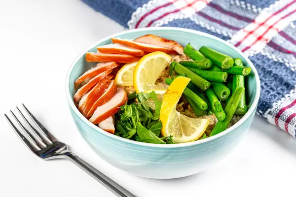 Oatmeal with chicken, spinach and broccolini