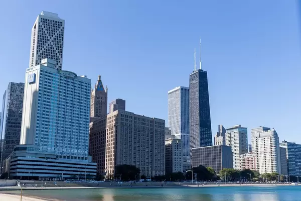 Ohio Street Beach on the Michigan Lakeshore offers great views of the Chicago skyline with skyscrapers and blue sky