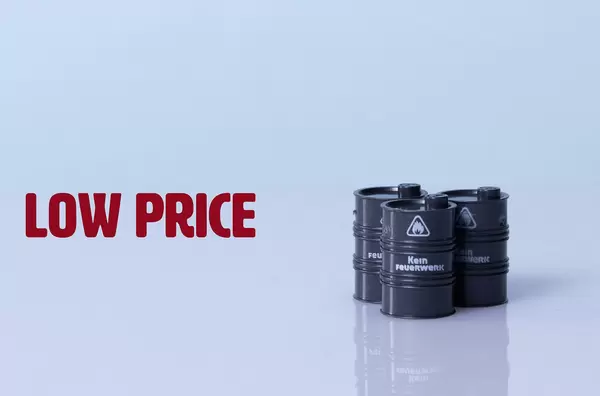 Oil barrels with Low price text