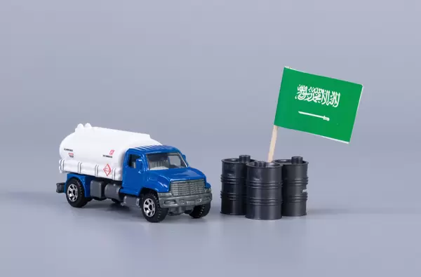 Oil truck and oil barrels with flag of Saudi Arabia