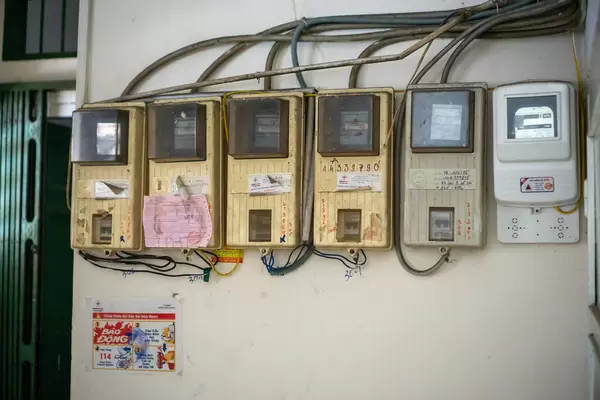 Old and New Electricity Meter on a Wall in a Residential Buidling in Ho Chi Minh City, Vietnam