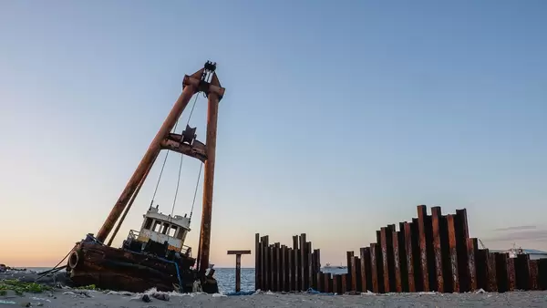 Old boat stranded on land at Bacolod harbour
