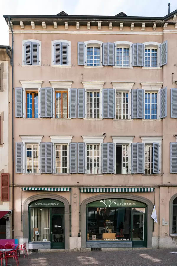 Old building in Swiss Sion with Italian window style shutters
