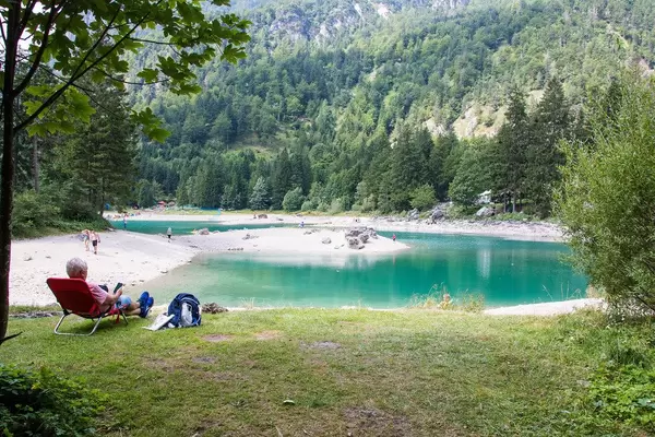 Old man enjoying the view at Predil lake