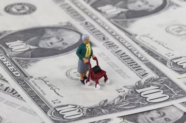 Old miniature women on dollar banknotes