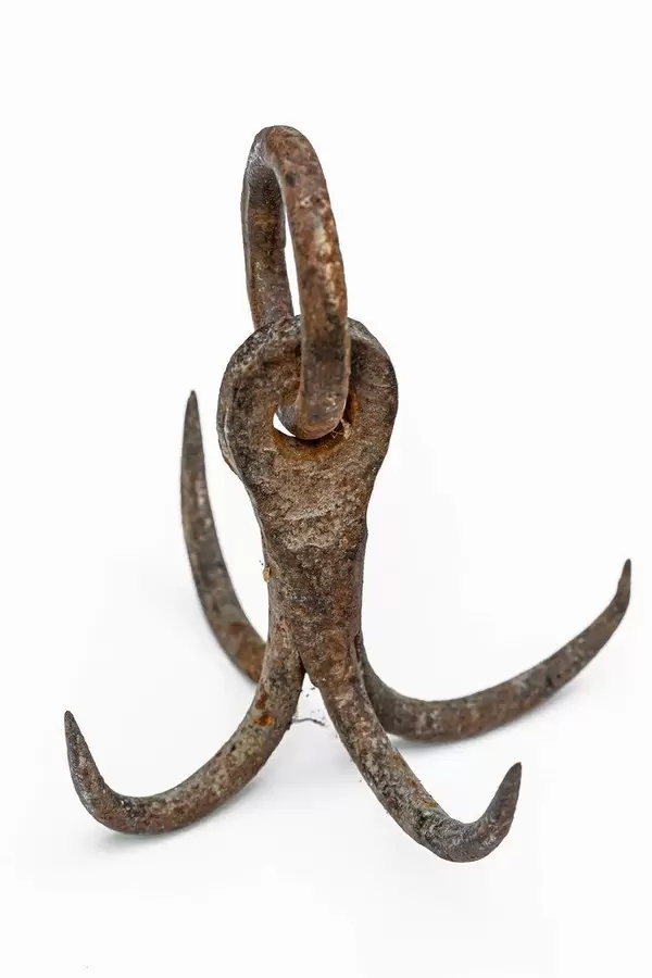 Old rusty hooks on white background